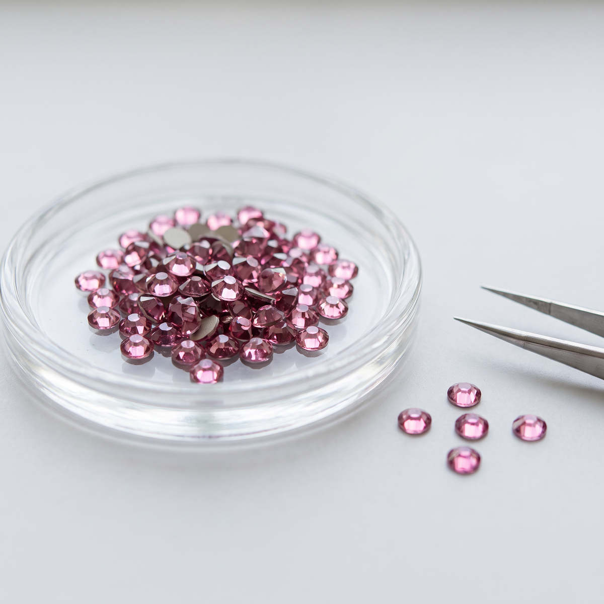 Rose Hot Fix Rhinestones in a glass dish