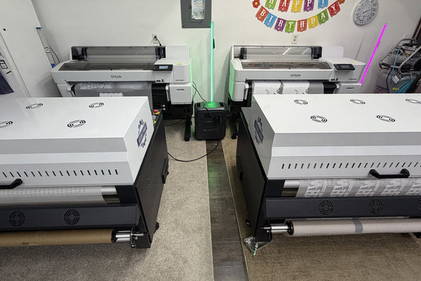 Our two Epson G6070 DTF printers and powder shakers at Wick Street Vinyl in Taylor, MI