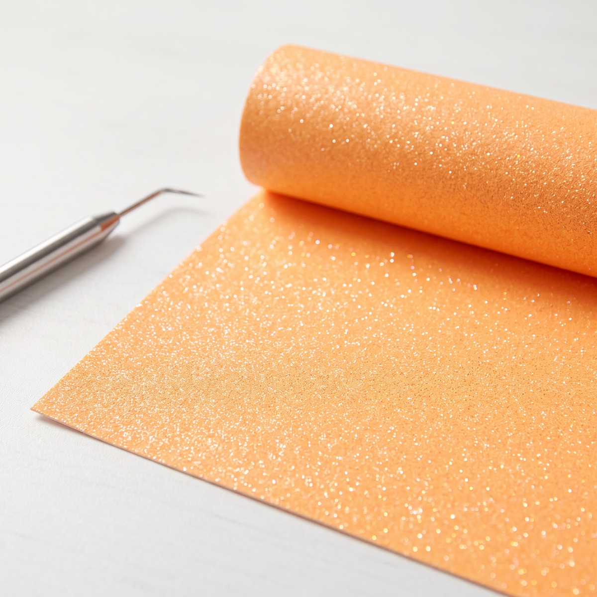 Roll of neon orange glitter heat transfer vinyl