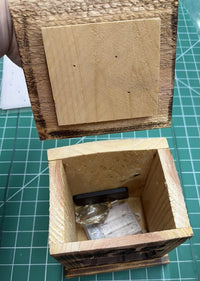 Wood lantern with the lid off, showing the inside